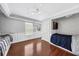 Bedroom with hardwood floors, built-in shelving and a daybed at 205 N Village St, Celebration, FL 34747