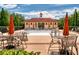 Community pool with ample seating and umbrellas on a beautiful day at 205 N Village St, Celebration, FL 34747