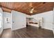 Living room with wood ceiling, built-in shelving and decorative cushions at 205 N Village St, Celebration, FL 34747