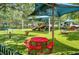 Community playground with slides, swings, and picnic tables at 205 N Village St, Celebration, FL 34747