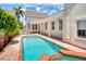 Inviting backyard pool area with brick pavers, perfect for relaxing and entertaining at 205 N Village St, Celebration, FL 34747