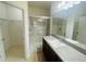 Bathroom featuring a granite vanity and walk-in shower at 2243 Seven Oaks Dr, St Cloud, FL 34772