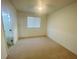 Bright bedroom features neutral carpet, window with blinds, and ceiling fan at 2243 Seven Oaks Dr, St Cloud, FL 34772
