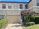 Charming townhouse with a well-manicured lawn and a one-car garage at 2243 Seven Oaks Dr, St Cloud, FL 34772