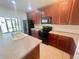Well-equipped kitchen features an island, stainless steel appliances, and ample counter space at 2243 Seven Oaks Dr, St Cloud, FL 34772