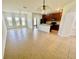 Open-concept living and dining area features tile floors, a ceiling fan, and natural light at 2243 Seven Oaks Dr, St Cloud, FL 34772