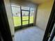 Private screened porch overlooks lush green lawn and community area, perfect for relaxing at 2243 Seven Oaks Dr, St Cloud, FL 34772