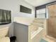 Bathroom featuring an elevated garden tub, walk in shower, and a toilet at 2444 Oak Mill Dr, Kissimmee, FL 34744