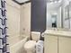 Bathroom featuring shower-tub combo, toilet, and vanity with mirror at 2444 Oak Mill Dr, Kissimmee, FL 34744