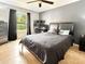 Bedroom features a ceiling fan, dark accents, natural light, and tile flooring at 2444 Oak Mill Dr, Kissimmee, FL 34744