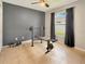 Bedroom featuring tile floor, a bench press with weights, a ceiling fan, and natural lighting at 2444 Oak Mill Dr, Kissimmee, FL 34744
