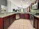 This kitchen features stainless steel appliances, tile flooring, and a functional layout at 2444 Oak Mill Dr, Kissimmee, FL 34744
