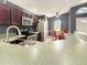 This kitchen features bar seating, stainless steel appliances, and convenient access to the dining area at 2444 Oak Mill Dr, Kissimmee, FL 34744