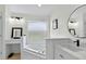 Bright bathroom offers a soaking tub, vanity, and modern fixtures at 2612 Keswick Ct, Kissimmee, FL 34744