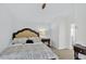 Cozy bedroom features a queen bed, patterned bedding, and neutral carpeting at 2612 Keswick Ct, Kissimmee, FL 34744