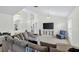 Inviting living room with a large sectional sofa, television, and cozy blue armchair perfect for relaxation and entertainment at 2612 Keswick Ct, Kissimmee, FL 34744