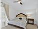 Comfortable bedroom features a queen bed, nightstand, and plush carpet, creating a relaxing retreat at 2612 Keswick Ct, Kissimmee, FL 34744