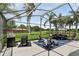 The outdoor patio includes a grill, seating area and expansive lake views at 2612 Keswick Ct, Kissimmee, FL 34744