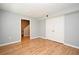 Bedroom with wood-look flooring, closet, and access to stairway at 267 Goldenrain Dr # 30, Celebration, FL 34747