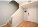 Entryway with stairs, front door, and wood-look flooring at 267 Goldenrain Dr # 30, Celebration, FL 34747
