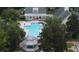 Aerial view of a community pool, gazebo, and surrounding greenery at 267 Goldenrain Dr # 30, Celebration, FL 34747