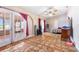 Large bedroom featuring terracotta tile flooring, a ceiling fan, and sliding glass doors to the outside at 2695 Hilliard Ct, Kissimmee, FL 34744