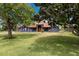 Beautiful single-story home with well-maintained lawn and mature trees offering shade and curb appeal at 2695 Hilliard Ct, Kissimmee, FL 34744