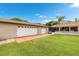 Detached two-car garage adjacent to the home with an outdoor patio and landscaped yard at 2695 Hilliard Ct, Kissimmee, FL 34744