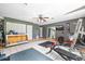 Bright home gym features exercise equipment, mirrors, tiled floors, and ample storage space at 2695 Hilliard Ct, Kissimmee, FL 34744