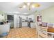 Eat-in kitchen featuring white cabinets, stainless steel appliances, and terracotta tile flooring at 2695 Hilliard Ct, Kissimmee, FL 34744