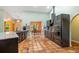 Modern kitchen with stainless steel appliances, granite countertops, tile flooring, and a breakfast nook area at 2695 Hilliard Ct, Kissimmee, FL 34744
