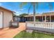 Outdoor patio showcasing an overhead trellis and views of the main house, perfect for outdoor entertaining at 2695 Hilliard Ct, Kissimmee, FL 34744