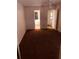 Cozy carpeted bedroom with neutral walls, a ceiling fan, and a door leading to an en-suite bathroom, offering privacy and convenience at 3036 S Semoran Blvd # S, Orlando, FL 32822
