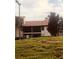 Exterior of the condo building with balconies on a grassy hill at 3036 S Semoran Blvd # S, Orlando, FL 32822