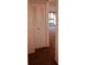 View of a hallway with closet and view of balcony at 3036 S Semoran Blvd # S, Orlando, FL 32822