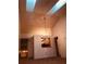 Spacious living room with high ceilings, a skylight and dining area at 3036 S Semoran Blvd # S, Orlando, FL 32822