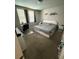 Comfortable bedroom with neutral walls, carpet flooring, and a large window for natural light at 3342 Curlew Ave, Leesburg, FL 34748