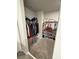 Walk-in closet with ample storage space, including shelves, hanging rods, and organization units at 3342 Curlew Ave, Leesburg, FL 34748