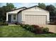 Beautiful home featuring a well-kept lawn and a two-car garage, perfect for suburban living at 3342 Curlew Ave, Leesburg, FL 34748