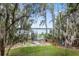 Scenic backyard with lush trees and tranquil view, creating a serene environment at 3807 S Semoran Blvd, Orlando, FL 32822