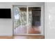Balcony features sliding glass doors, and a outdoor area with a lake view surrounded by lush trees at 3807 S Semoran Blvd, Orlando, FL 32822