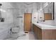 Bright bathroom with a glass enclosed shower and marble countertops at 3807 S Semoran Blvd, Orlando, FL 32822