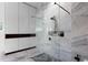 Modern bathroom features a glass shower enclosure and marble tiling at 3807 S Semoran Blvd, Orlando, FL 32822