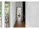 Hallway with view into room with brightly colored chair at 3807 S Semoran Blvd, Orlando, FL 32822