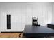 Modern kitchen with built in wine cooler, sleek white cabinets and black island at 3807 S Semoran Blvd, Orlando, FL 32822