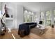 Bright living room with hardwood floors, modern furnishings, and large windows with beautiful views at 3807 S Semoran Blvd, Orlando, FL 32822