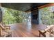 Spacious outdoor deck with chairs, overlooking water and trees, perfect for relaxation at 3807 S Semoran Blvd, Orlando, FL 32822