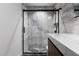 Modern shower with stylish marble, sleek fixtures, and a glass enclosure, adding luxury to the space at 3807 S Semoran Blvd, Orlando, FL 32822