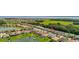 Scenic aerial view of a residential community featuring lakefront homes and lush green spaces in a desirable location at 3837 Carrick Bend Dr, Kissimmee, FL 34746