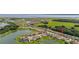 Beautiful aerial view of a lakeside residential community with houses nestled among trees and water features at 3837 Carrick Bend Dr, Kissimmee, FL 34746